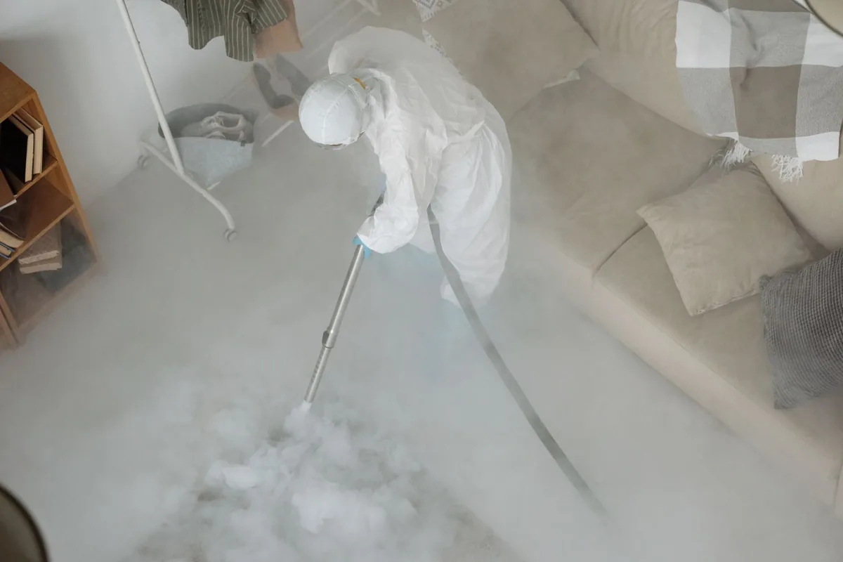 Biohazard cleanup technician in protective equipment, West Athens, CA